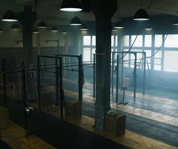 Clean and modern gym interior with exercise equipment.