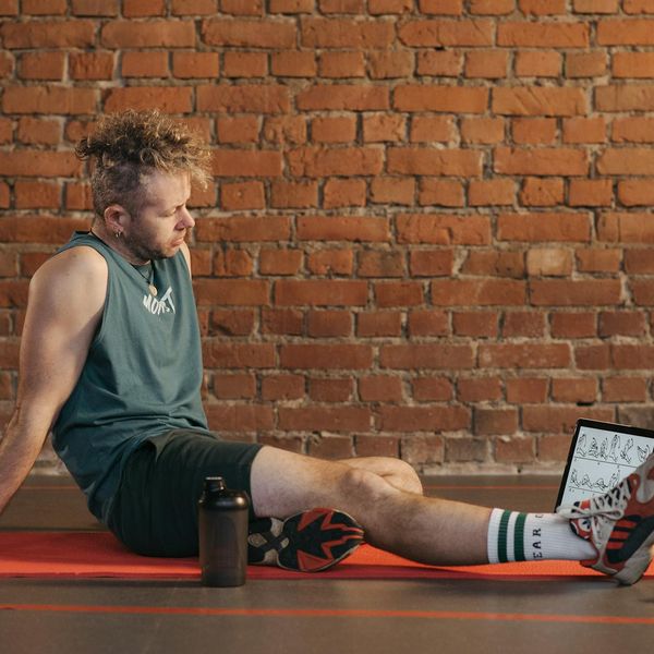 Man feeling energized and stretching after a workout session.